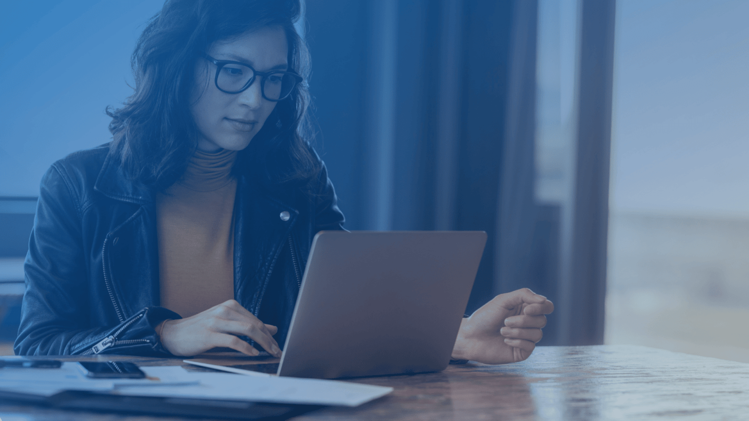 women on laptop reading TEBillion newsletter
